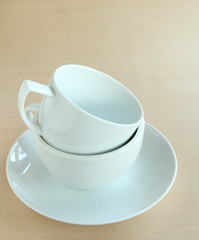 Cup of coffee on wooden board