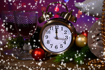 Wine glasses, retro alarm clock and Christmas decoration