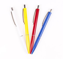 Color ball pens on white background