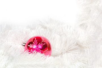 Pink retro ball and white Christmas tinsel
