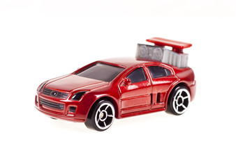 Fototapeta na wymiar Red toy car on a white background