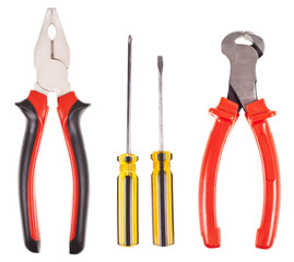 Pliers, screwdrivers and nippers on a white background
