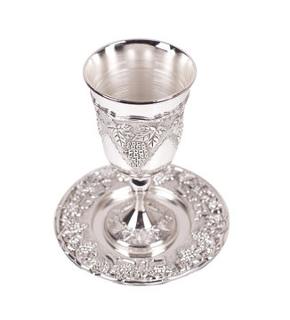 Silver kiddush wine cup and saucer on a white background