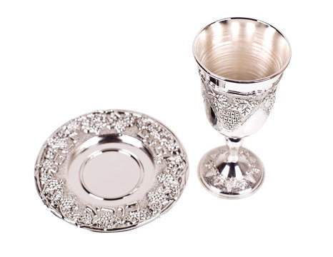 Silver kiddush wine cup and saucer on a white background