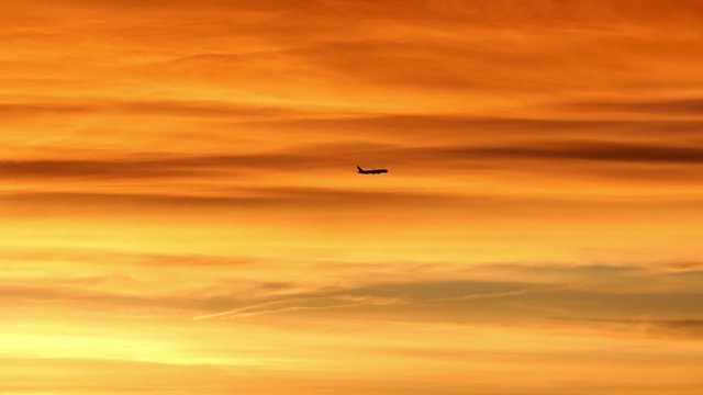 sunrise airplane crossing