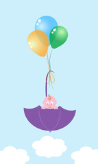 baby in an umbrella on balls