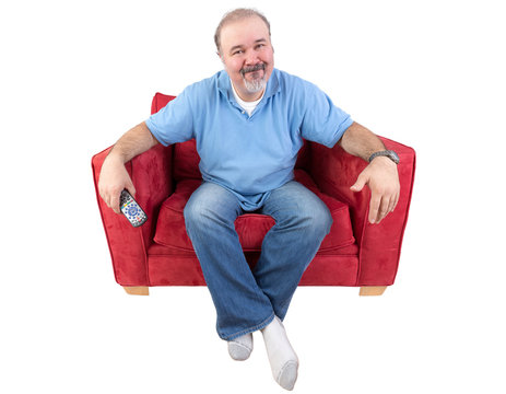 Man Sitting With A Remote And Al Bored Look