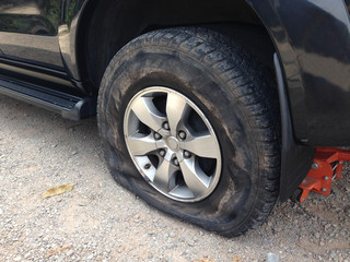 Torn tyre  of the black van