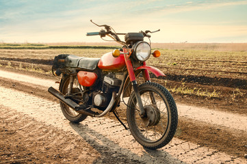 Fototapeta premium Classic old motorcycle on a dirt road.