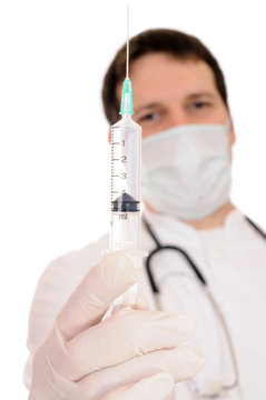Syringe in doctor hand