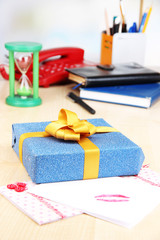 Gift with card for loved one on desktop close-up