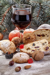 wine glass with fruit cake, nuts and fruits