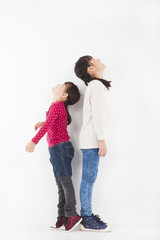 happy little girle standing together and looking up