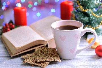 Composition of book with cup of coffee and Christmas