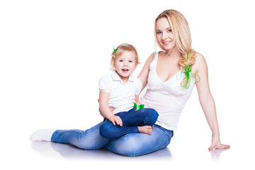 closeup portrait of young mother hug her little daughter