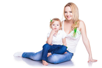 closeup portrait of young mother hug her little daughter