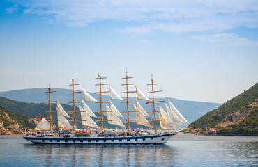 Big sailing ship goes on the water of Kotor Bay