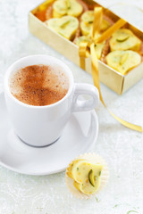 Homemade white chocolate candy heart, cup of hot coffee