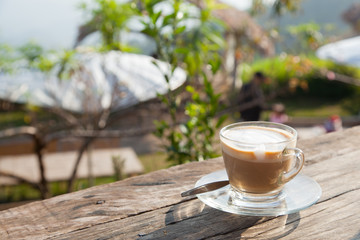 Coffee laid on wooden terrace
