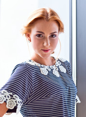 young beautiful woman in striped blouse
