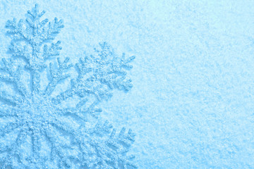 Beautiful snowflake on snow