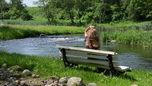 woman on bench unbind hair resting admire nature enjoying sun