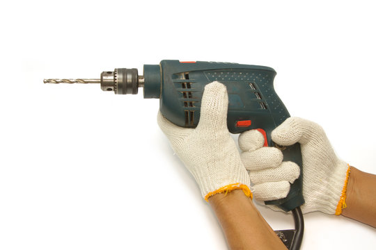 Carpenter's hand with  electrical drill