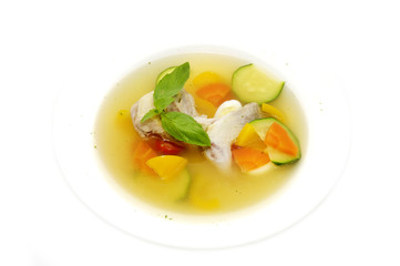 quail soup and vegetables on a white background