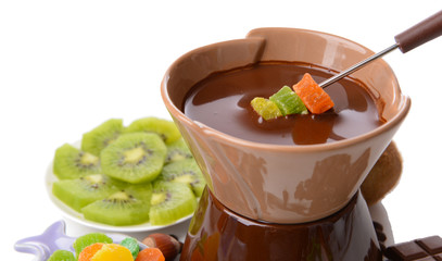 Chocolate fondue with fruits, isolated on white