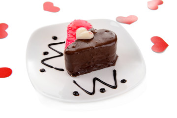 Sweet cake with chocolate on plate isolated on white