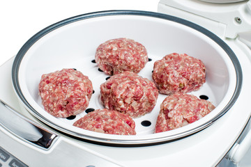 Raw beef cutlets in boiler