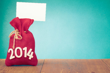 New Year greeting card with Santa bag and gift tag