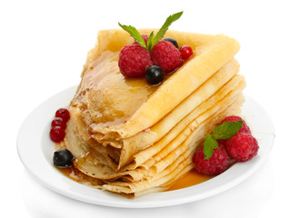 Delicious pancakes with berries and honey