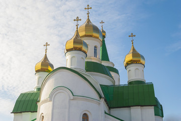 Fototapeta na wymiar Domes of orthodox temple against the sky.