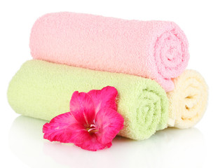 bright towels and flower isolated on white