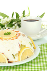 Delicious jelly cake on table on white background
