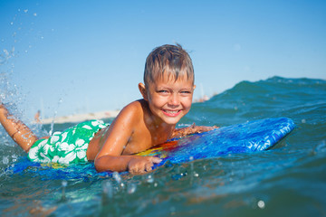 boy has fun with the surfboard