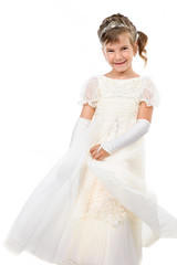 Fototapeta na wymiar little girl wearing gown dancing isolated on white