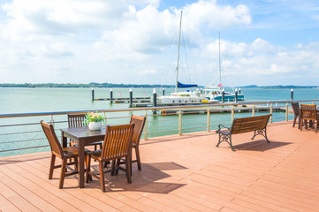 wooden table and chair at outdoor cafe
