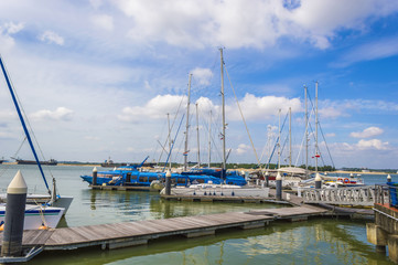 Fototapeta na wymiar Yachts and boats in Danga Bay marina of Johor, Malaysia