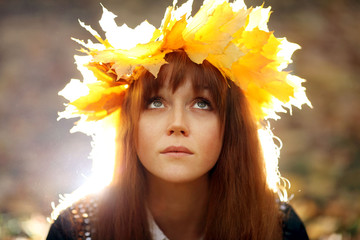 portrait of a woman wearing a wreath of maple leaves