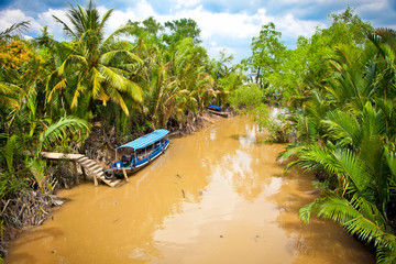 Cannal with Boats in Mekong delta, Ben Tre, Vietnam.