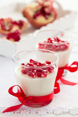 Creamy panna cotta with pomegranate seeds.