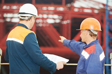 Engineers builders at construction site
