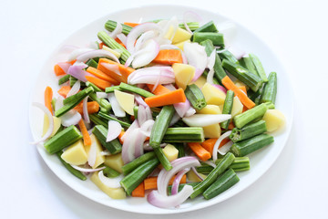 Mixed vegetables in a plate background