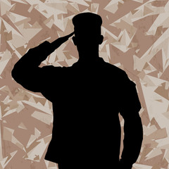 Saluting soldier's silhouette on a desert army camouflage backgr