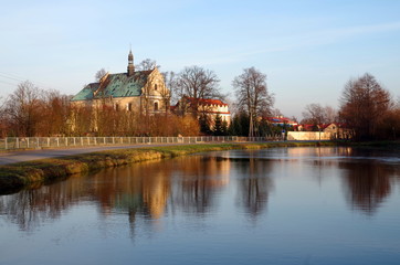 Baroque monastery near the pond in Lutomiersk