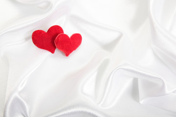 Red hearts on pearls background