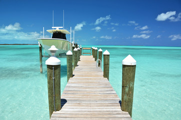 Yacht at the wooden jetty. Exuma, Bahamas