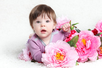 Baby with pink peonies
